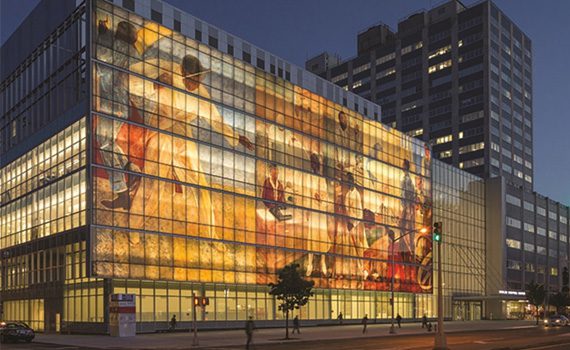 Pictured: The exterior of Harlem Hospital, with digital printing on the glass façade.